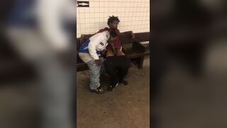 Two homeless black men having oral fun at a subway station