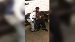 Two homeless black men having oral fun at a subway station