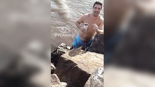 Latino pissing on the beach