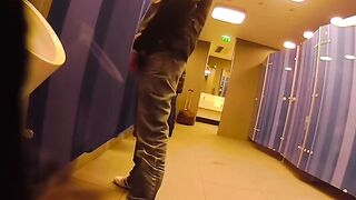 Putting on a show and getting a helping hand in a public restroom