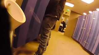 Putting on a show and getting a helping hand in a public restroom