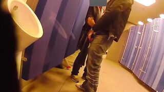 Putting on a show and getting a helping hand in a public restroom