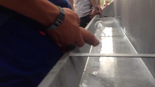 Spy pissing men at Dour Festival