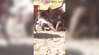 guy caught touching his erect cock on the beach