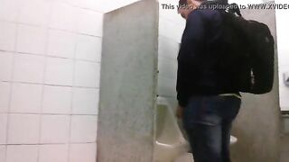 Man caught jerking his cock at the public urinals