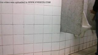 Man caught jerking his cock at the public urinals