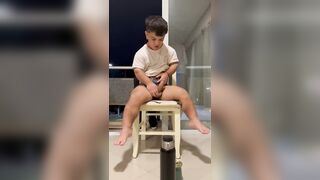 midget young guy rubbing his cock solo on a chair