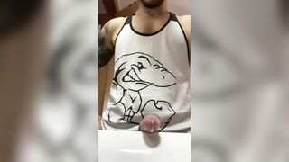 Muscular tattooed dude with a huge cock shooting a load in the bathroom sink