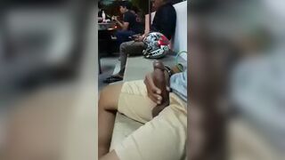 Horny black showing off his cock on the street