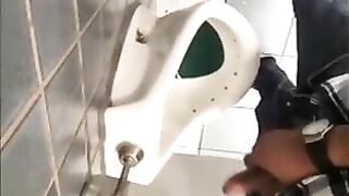 Horny guys jerking off in a public restroom