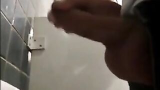 Horny guys jerking off in a public restroom