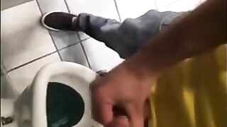 Horny guys jerking off in a public restroom