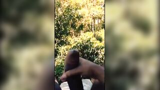 Black dude stroking his huge meaty cock outdoor