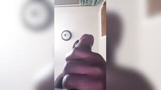 Young black dude strokes his delicious meaty curved cock