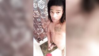Sexy young jamaican dude stroking his curved cock in the shower