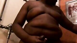 Big chubby black guy rubbing his fat uncut cock