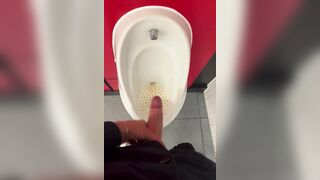 Horny young dude having a huge orgasm in a public toilet
