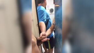 Getting a handjob by two guys in the gym bathroom