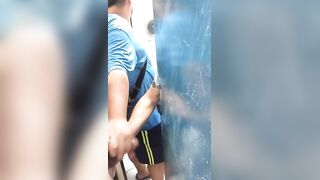 Getting a handjob by two guys in the gym bathroom
