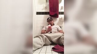 Young dude using a flesh light to masturbated in the bathroom