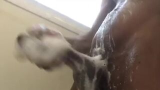 Nigga soaps up his huge cock