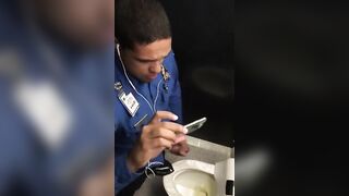 Horny cop masturbating in public toilet while watching porn on his phone
