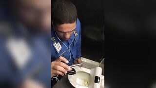 Horny cop masturbating in public toilet while watching porn on his phone
