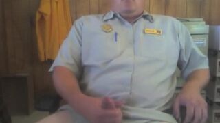 Big white bear strokes his cock in his office