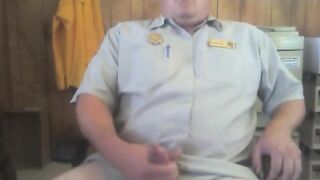 Big white bear strokes his cock in his office