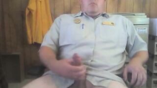 Big white bear strokes his cock in his office