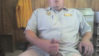 Big white bear strokes his cock in his office
