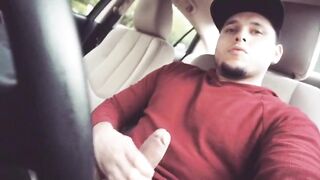 Cute young dude rubbing his cock in his car