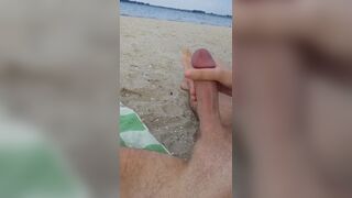 Stroking my cock and  relaxing on the beach
