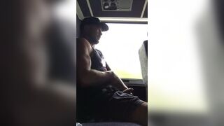 Muscular stud stroking his cock in public Bus