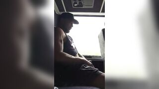 Muscular stud stroking his cock in public Bus