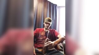 Horny white guy pissing while masturbating