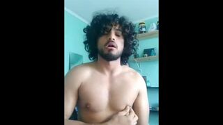 Long hair latino stroking his fat cock in front of the camera