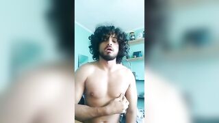 Long hair latino stroking his fat cock in front of the camera
