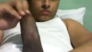 Horny nicaraguan guy stroking his cock in front of the webcam
